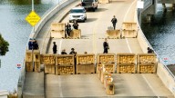 Shots fired, driver hurt and held after truck rams into Coast Guard base in San Francisco