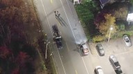 SUV, work truck collide head