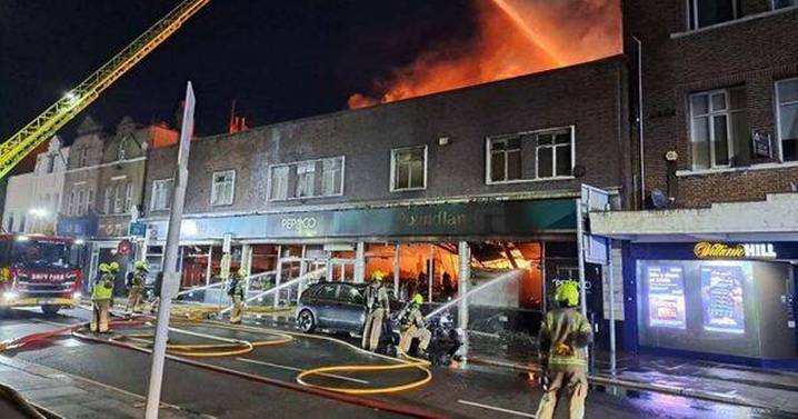 Huge fire rips through Poundland shop as 100 firefighters rush to tackle blaze