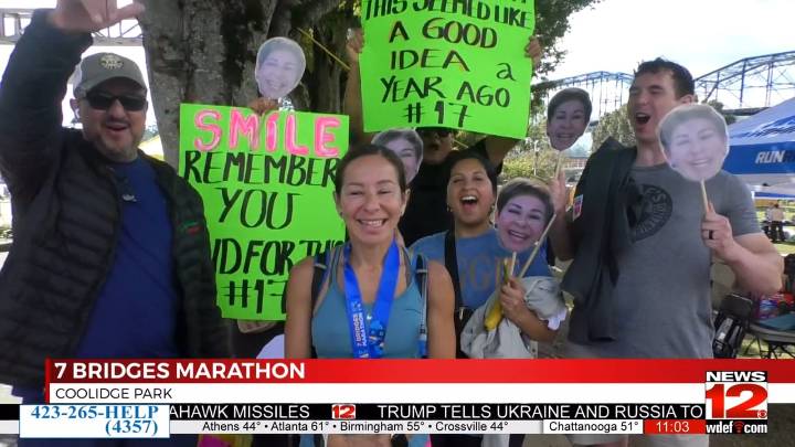 Runners cross finish line at the 7 Bridges Marathon