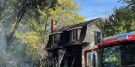 Crews fight garage fire in Muscatine