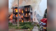 Kansas City fire crews battle fully-involved apartment fire