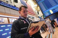 Most US stocks rise after swinging through another erratic day