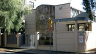 Man arrested after allegedly pointing gun at a synagogue in Sydney from a moving truck