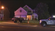 Woman fatally shot outside her home; police fire at suspect