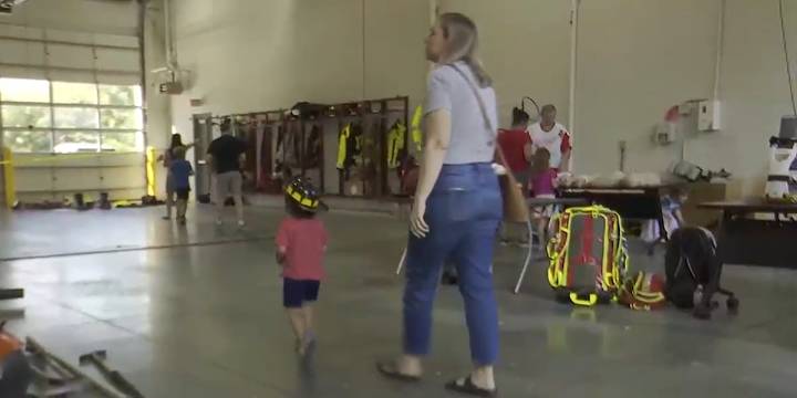 Experiencing what firefighters do with Meridian Township open house