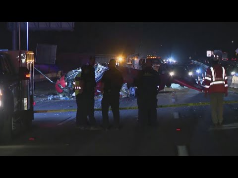 Bystanders lift wreckage after helicopter crash on Highway 50 in Sacramento
