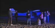 Small plane makes emergency landing on Huntington Beach shore