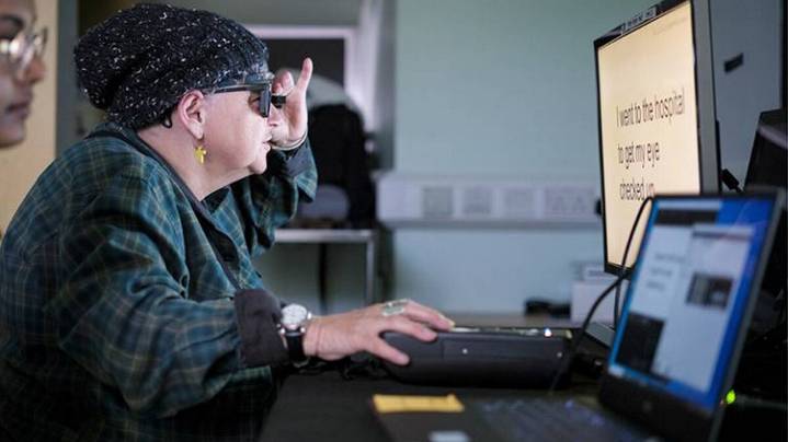 A Combination Implant and Augmented Reality Glasses Restores Reading Vision to Blind Eyes