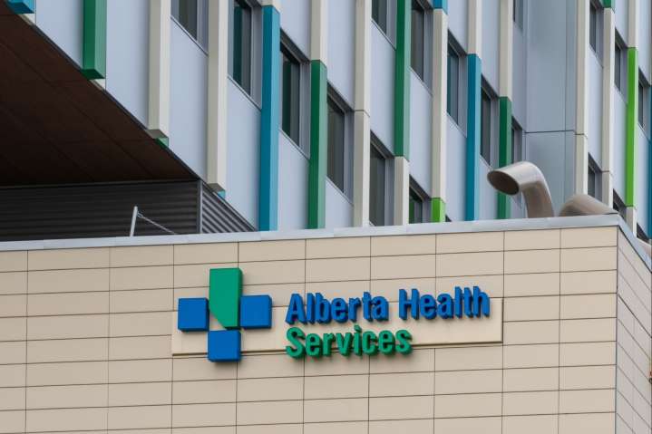 Alberta Health Services cuts 100 positions in corporate roles