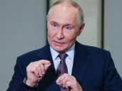 Putin slams U.S. sanctions as ’unfriendly,’ EU adds more