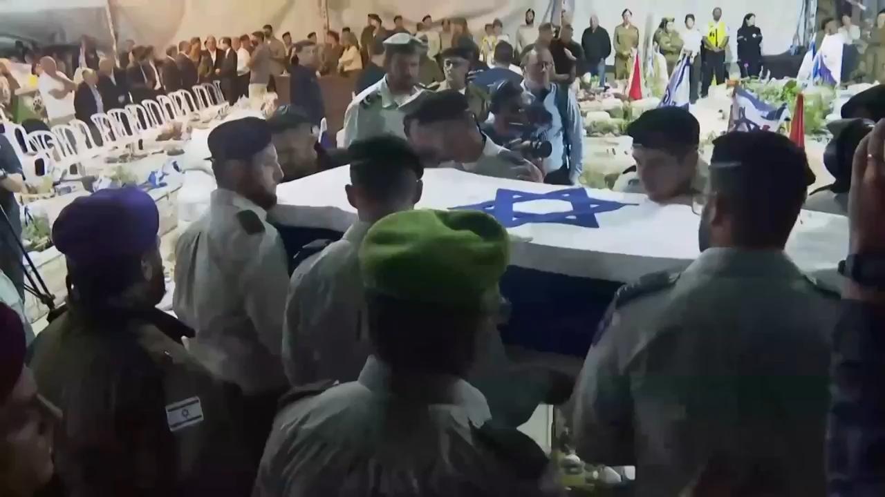 Released hostage and president attend funeral of Israeli soldier whose remains were returned