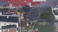 Firefighters battle fire at truck repair shop in Bridgeport, Pa.