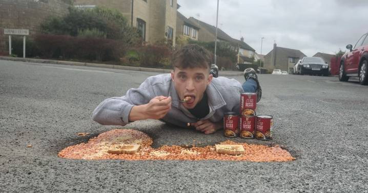 Man turns pothole into giant bowl of beans on toast