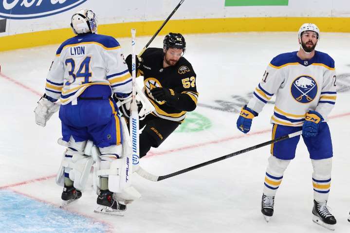 Bruins hold off Sabres to remain perfect through three games
