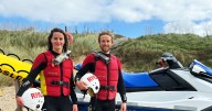 Struggling swimmer rescued from stormy sea by surfers