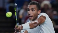 Auger-Aliassime keeps ATP Finals hopes alive with first