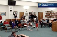 Protesters undress at Augusta school board meeting over Title IX policy