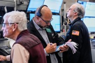 US stocks pull back from their records as gold's price drops again