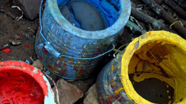 The Clever Wax Paper Trick That'll Save Your Paint From Drying Up In The Can