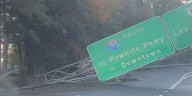 Photos: Tractor-trailer drives through median, strikes sign on I