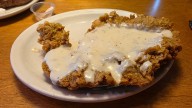 The Cut Of Beef Texas Roadhouse Uses For Country Fried Steak Explains Why It's So Delicious