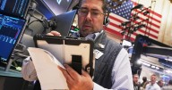 Wall Street holds steady at the cusp of its records