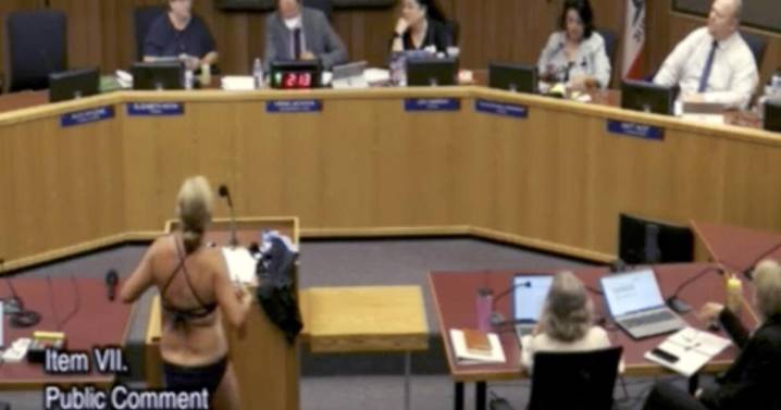 Woman undresses at a California school board meeting to protest transgender bathroom policies