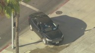 Man barricaded in car after driving onto sidewalk in front of LA City Hall
