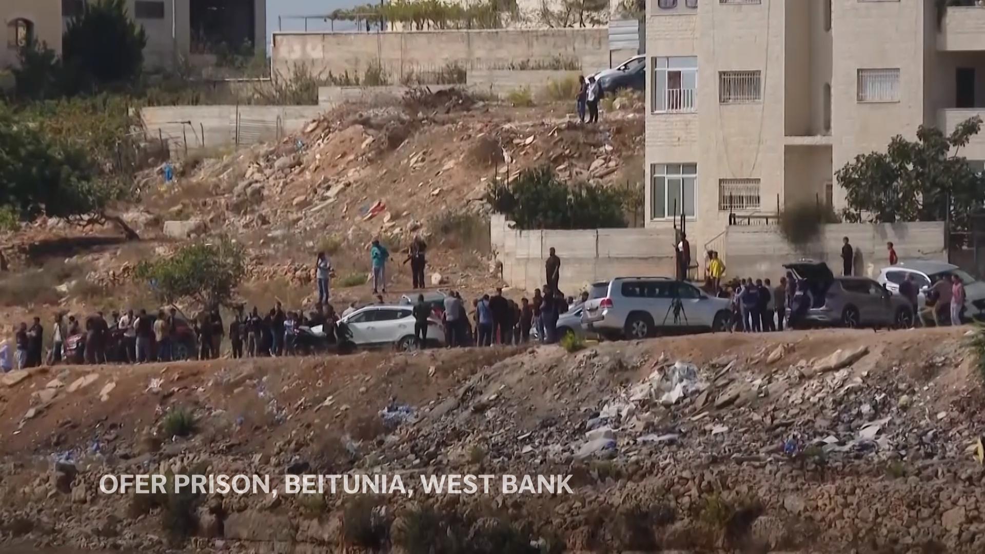 Israeli military vehicles fire tear gas at crowds awaiting prisoner releases in West Bank