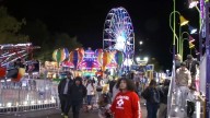 Fair and concertgoers taking traffic into consideration during dual events