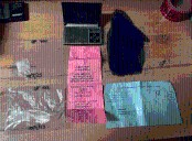 2 facing charges after attempting to pay water bill with meth, forged check