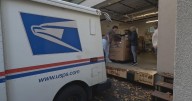 USPS mail carriers in Massachusetts go door to door to collect donations for annual food drive