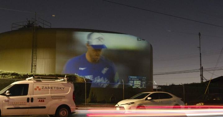 Remember the Dodgers fans who projected the World Series on an East LA water tank? They’re at it again