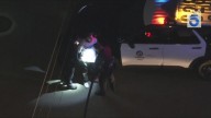 Armed man in Dodgers jersey taken into custody after L.A. police chase