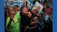 Israel says Hamas hands over the first seven hostages to the Red Cross as part of the Gaza ceasefire