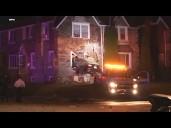 Car goes airborne, slams into side of home