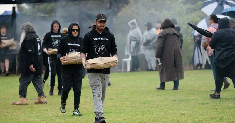 Community healing together as ancestors reburied