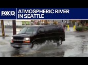 Pooling water on Seattle streets as atmospheric river rolls in