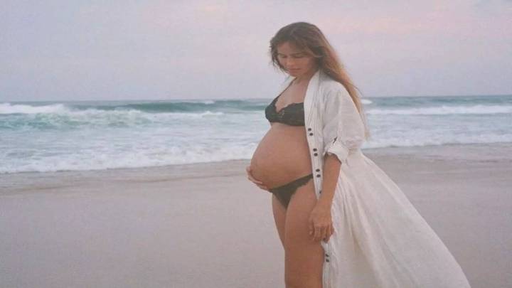 Isabel Lucas announces pregnancy with partner Cyrus Sutton.