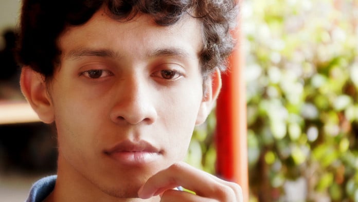 Young Man Carefully Weighs Choice Between Fleeting Pleasure, Everlasting Joy