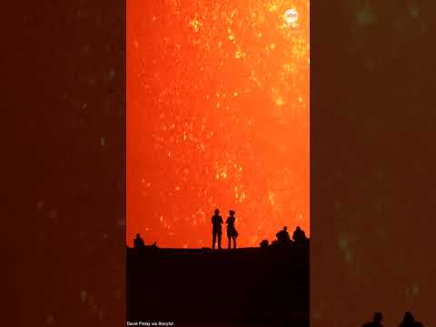 Mesmerizing sight as volcano watchers silhouetted against Kilauea’s lava fountain