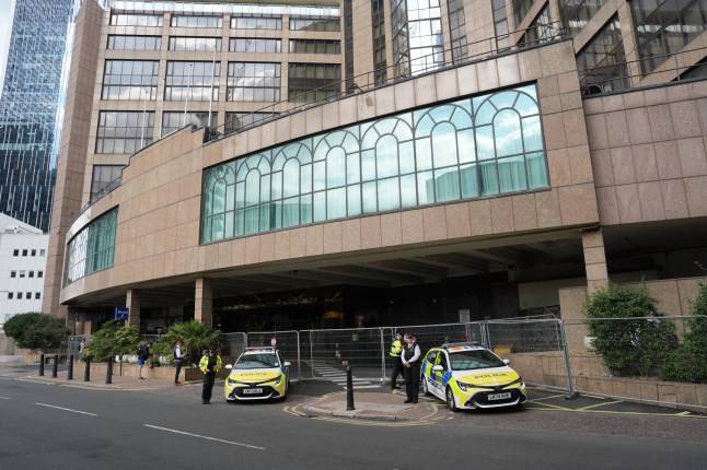 Anti-migrant protesters laugh as firefighters rush to Brittania hotel in Canary Wharf