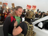 Photos:  Protesters clash with federal agents outside Coast Guard Island as immigration enforcement descends on Bay Area
