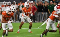 Miami's perfect season hopes are dashed as Beck throws 4 interceptions in loss to Louisville