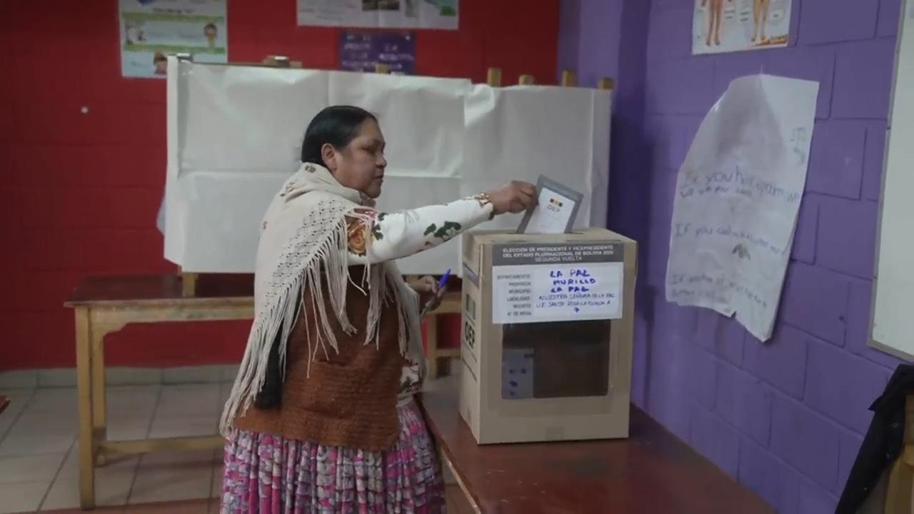 Polls open in Bolivia in tight runoff as voters seek a president to lift them from crisis