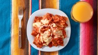 Don't Toss Your Stale Taco Shells, Make Chilaquiles With Them Instead