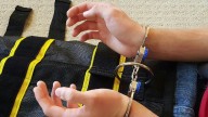 Takeaways from the AP investigation into ICE's use of a full-body restraint device known as the WRAP