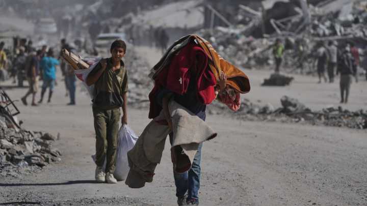 Palestinians return to ruins in Gaza as ceasefire holds
