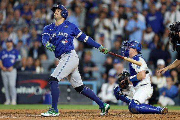 Blue Jays' George Springer exits after injuring himself on swing